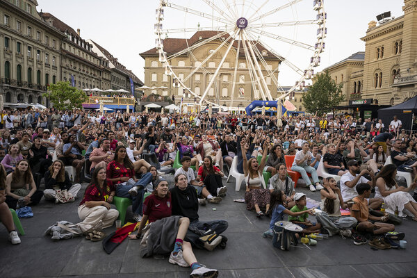 Spectators watch the Group C match of the UEFA Women's Euro 2025 soccer championships between Sweden and Germany, in the Fanzone on the Federal Square in Bern.
