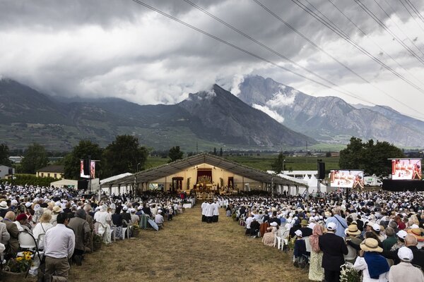 A thunderstorm approaches during the episcopal consecration of priests in a mass organized by the Society of Saint Pius X (SSPX), in Econe near Sion, Switzerland
