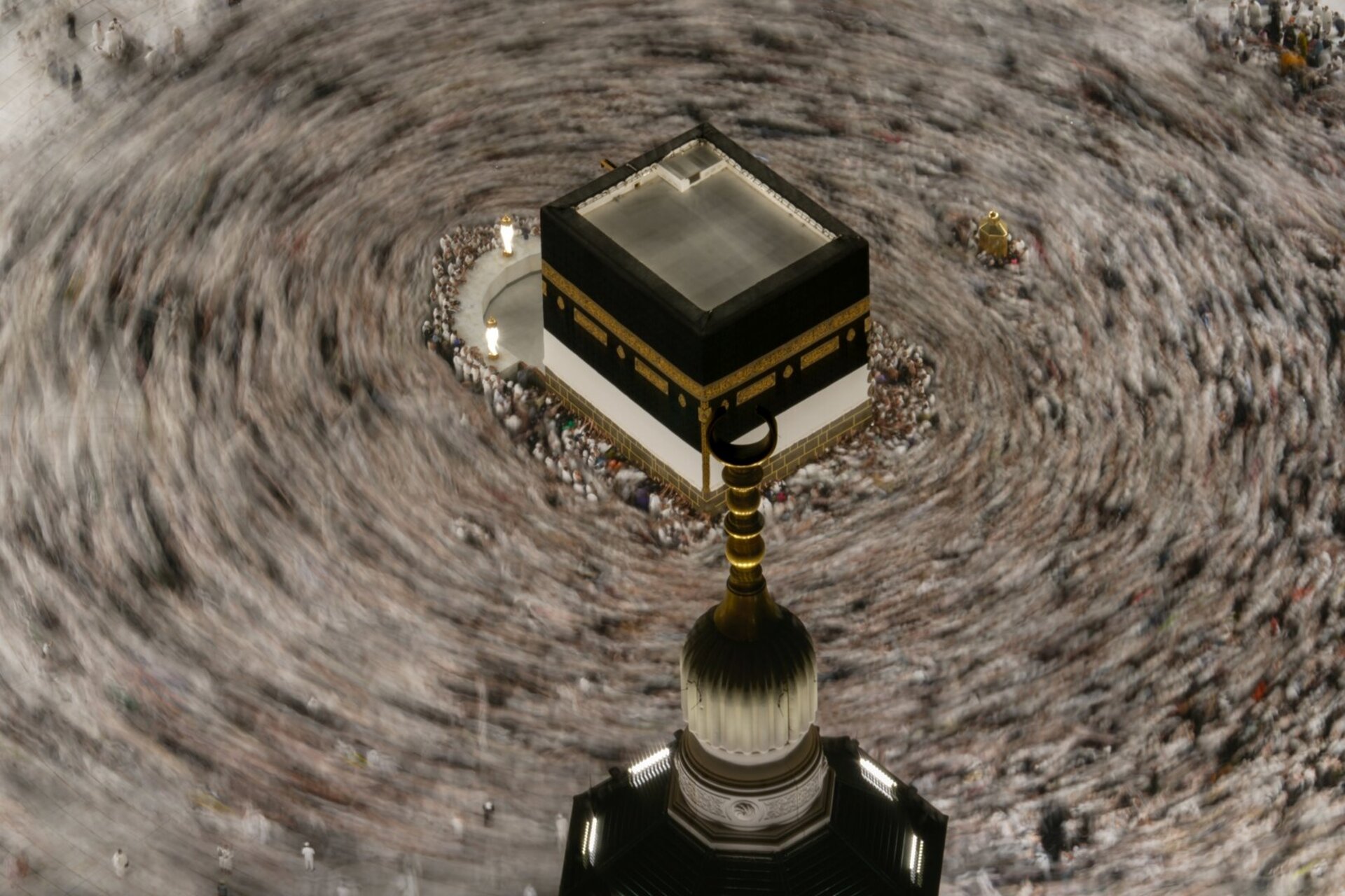 this photograph made with a slow shutter speed shows Muslim pilgrims circumambulating the Kaaba, Islam's holiest site at the Grand Mosque during the annual Hajj pilgrimage in Mecca, Saudi Arabia