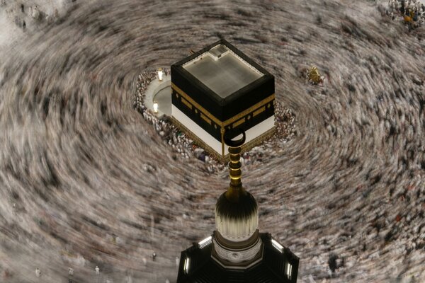 This photograph made with a slow shutter speed shows Muslim pilgrims circumambulating the Kaaba, Islam's holiest site at the Grand Mosque during the annual Hajj pilgrimage in Mecca, Saudi Arabia
