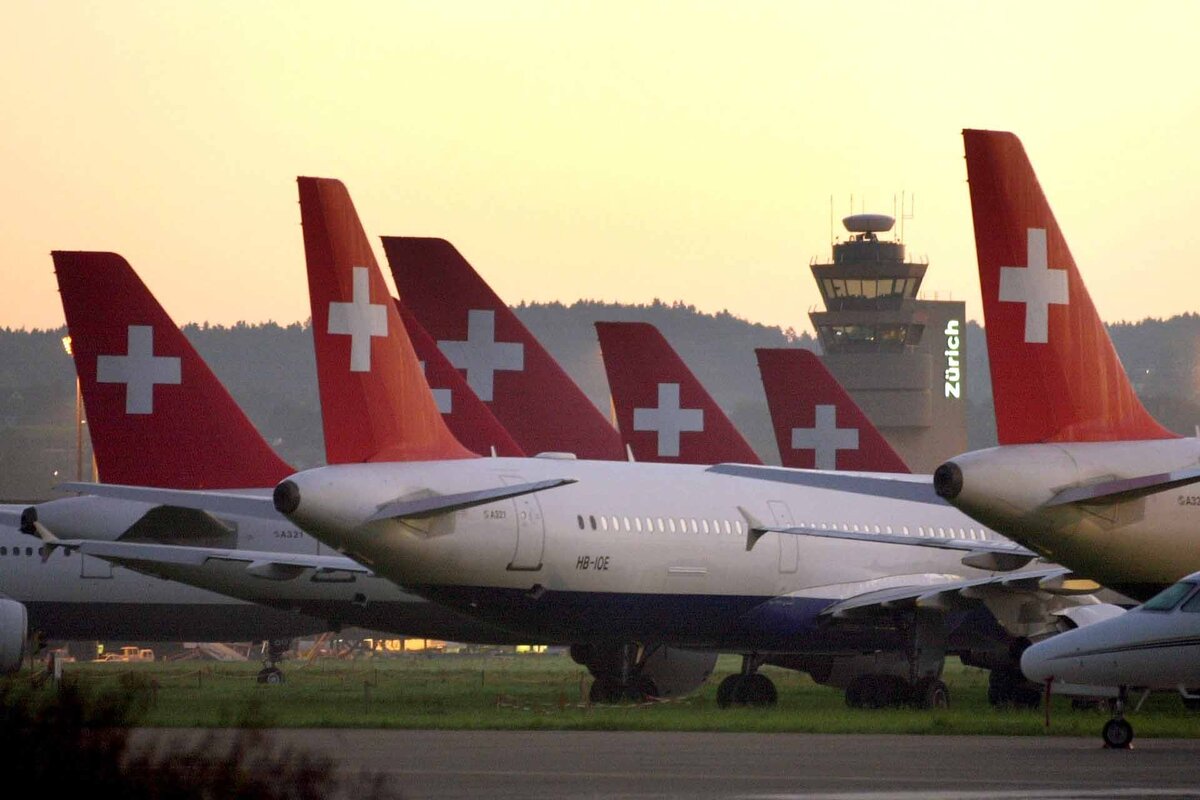 Swissair planes remain on the ground at the airport in Zurich-Kloten, Switzerland, in the early morning hours, October 3, 2001. Swissair's entire fleet remains grounded as the collapsed Swiss flag carrier fights for survival amid a severe cash crunch despite last-minute injection of badly-needed cash from Switzerland's top banks.