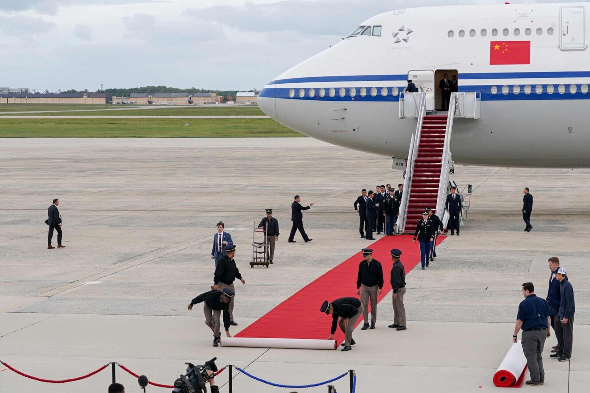 A red carpet is prepared near the mobile stairs of an Air China Boeing aircraft carrying Chinese President Xi Jinping following its arrival at Joint Base Andrews, Maryland, USA, 23 September 2026.