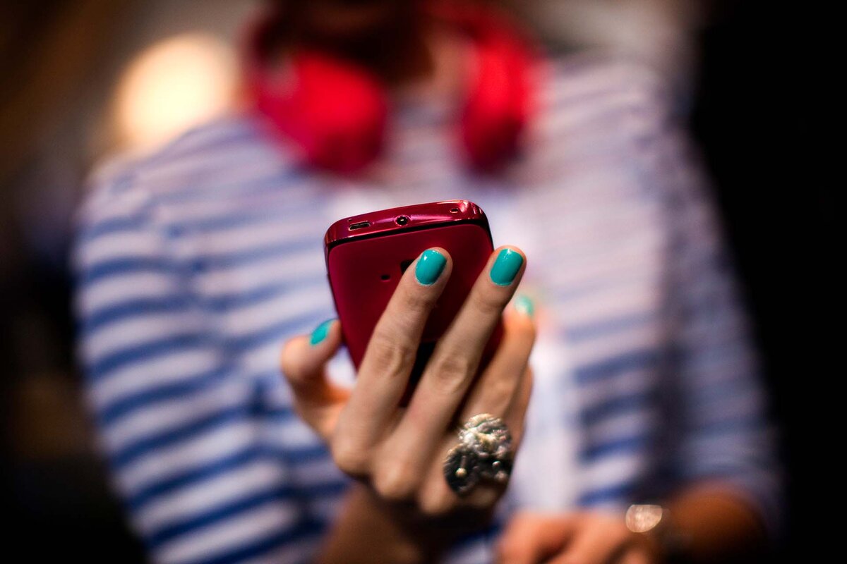 A woman holds a new model of Nokia mobile phone at the Mobile World Congress in Barcelona, Spain, Monday, Feb. 27, 2012. Struggling cell phone maker Nokia Corp. has unveiled two new handsets that it hopes will revive its fortunes at the start of the world's largest mobile phone trade show on Monday.