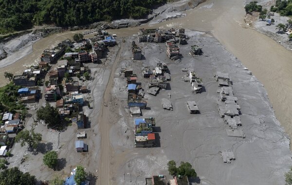 An aerial view of damaged homes in Delight village following a flash flood, in Nuwakot district, Nepal, 27 August 2026.
