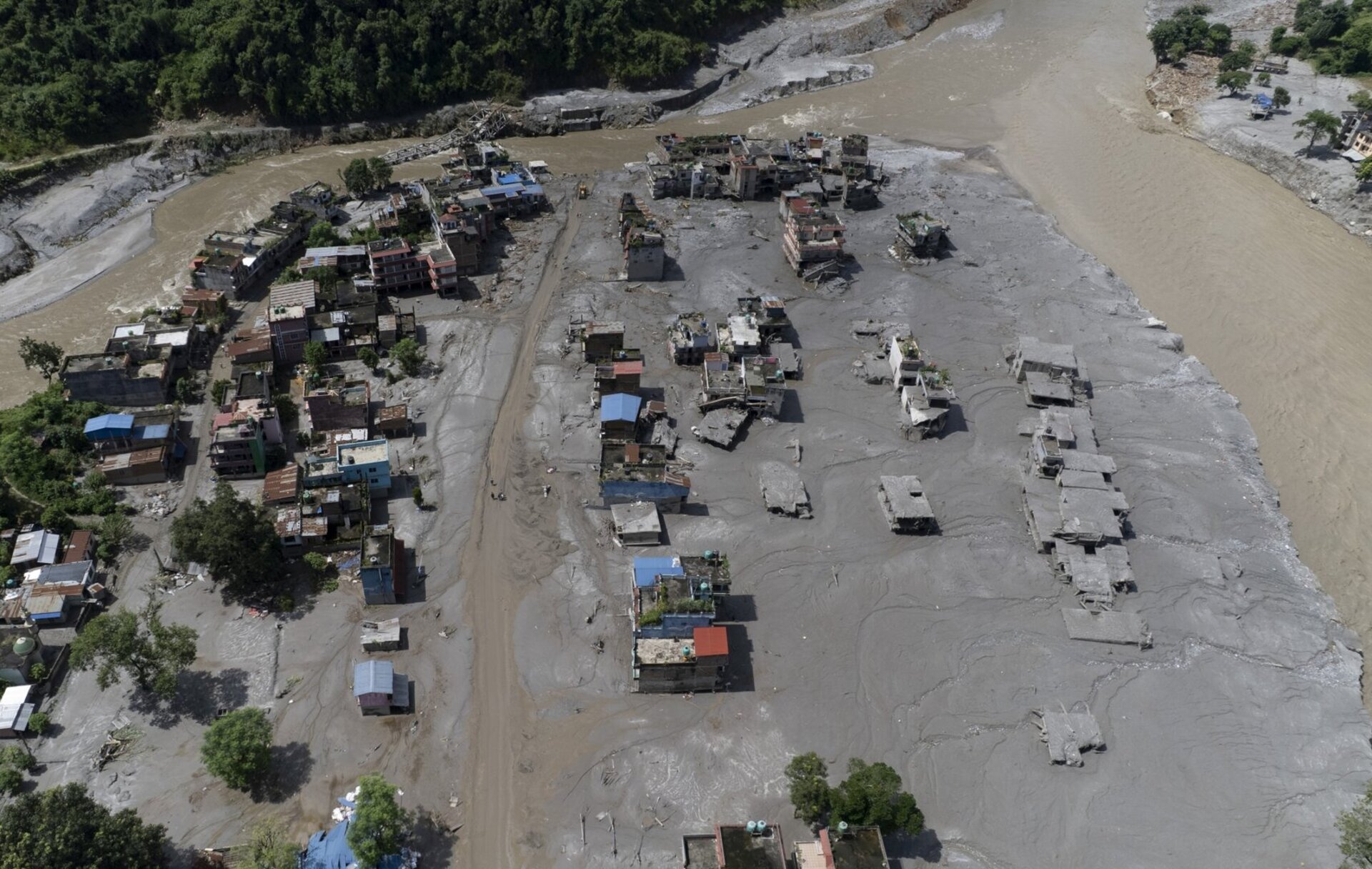 An aerial view of damaged homes in Delight village following a flash flood, in Nuwakot district, Nepal, 27 August 2026.