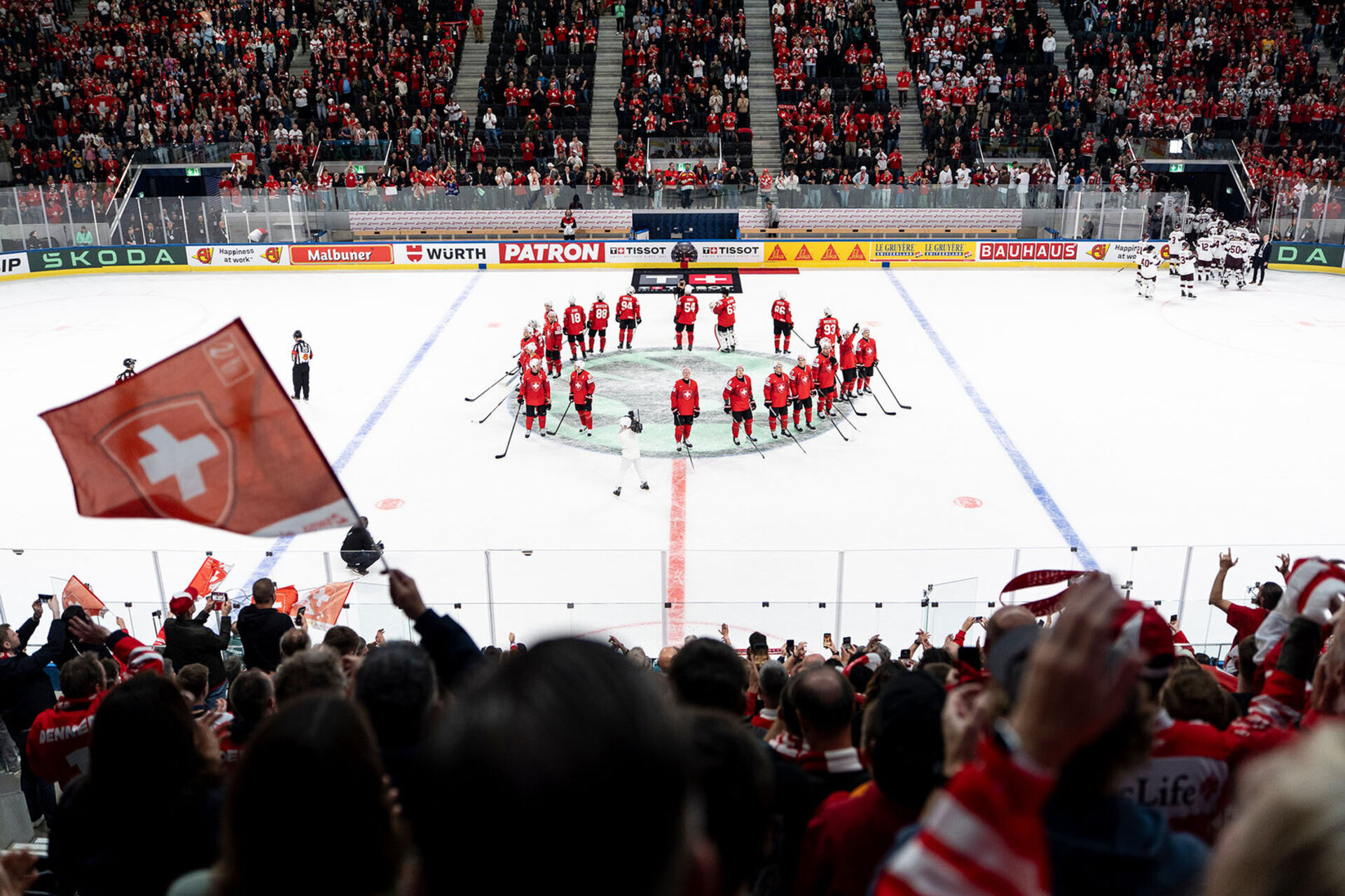 The swiss team celebrates after the 2026 IIHF Men's Ice Hockey World Championship preliminary round group A game between Switzerland and Latvia