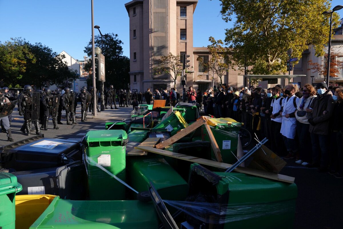 Students face police officers in front of the Helene Boucher high School during a protest against under-resourced schools, in Paris, Thursday Oct. 8, 2026.