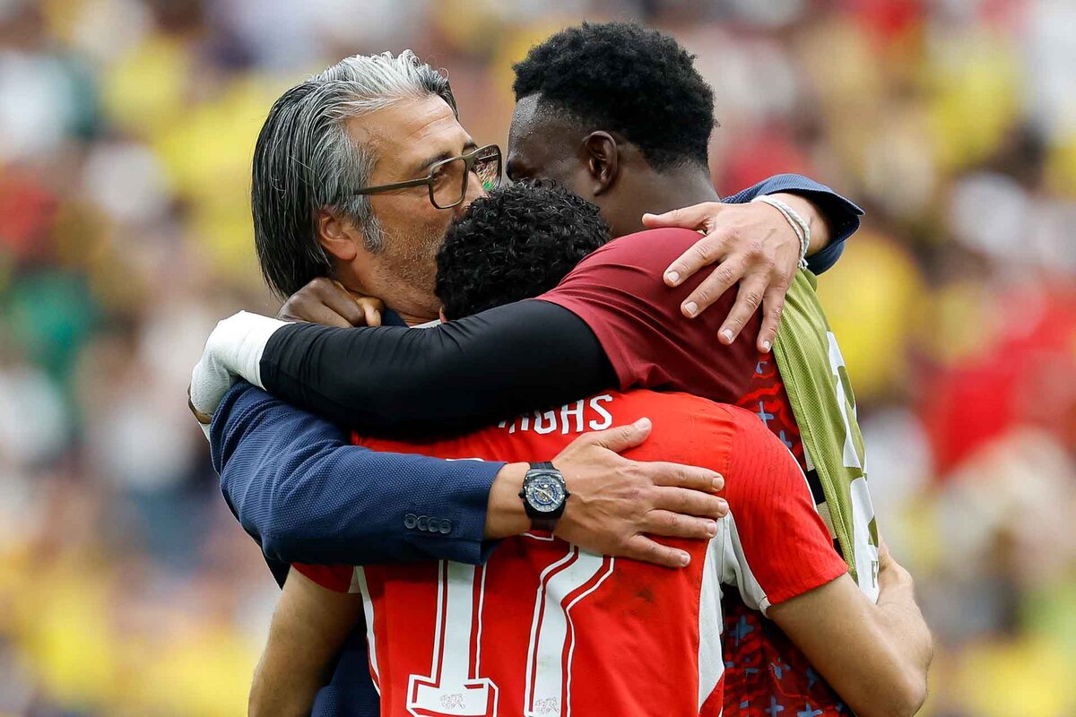 From left: Switzerland's head coach Murat Yakin, Switzerland's Ruben Vargas and Switzerland's goalkeeper Yvon Mvogo celebrate after the World Cup round of 16 soccer match between Switzerland and Colombia at the BC Place stadium in Vancouver, Canada, Tuesday, July 7, 2026, during the 2026 FIFA World Cup soccer tournament. 
