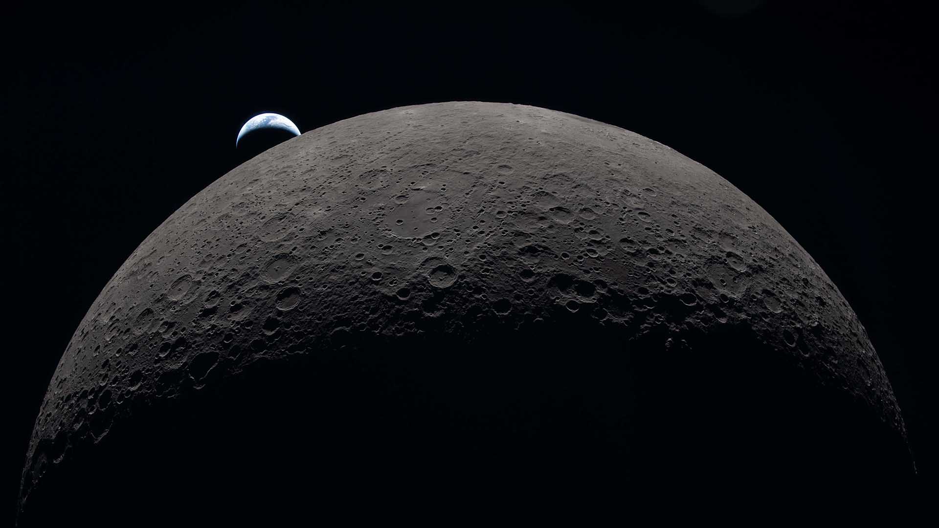 In this image provided by NASA, the Artemis II crew captured this view as the Earth sets behind the Moon during a lunar flyby, Monday, April 6, 2026.