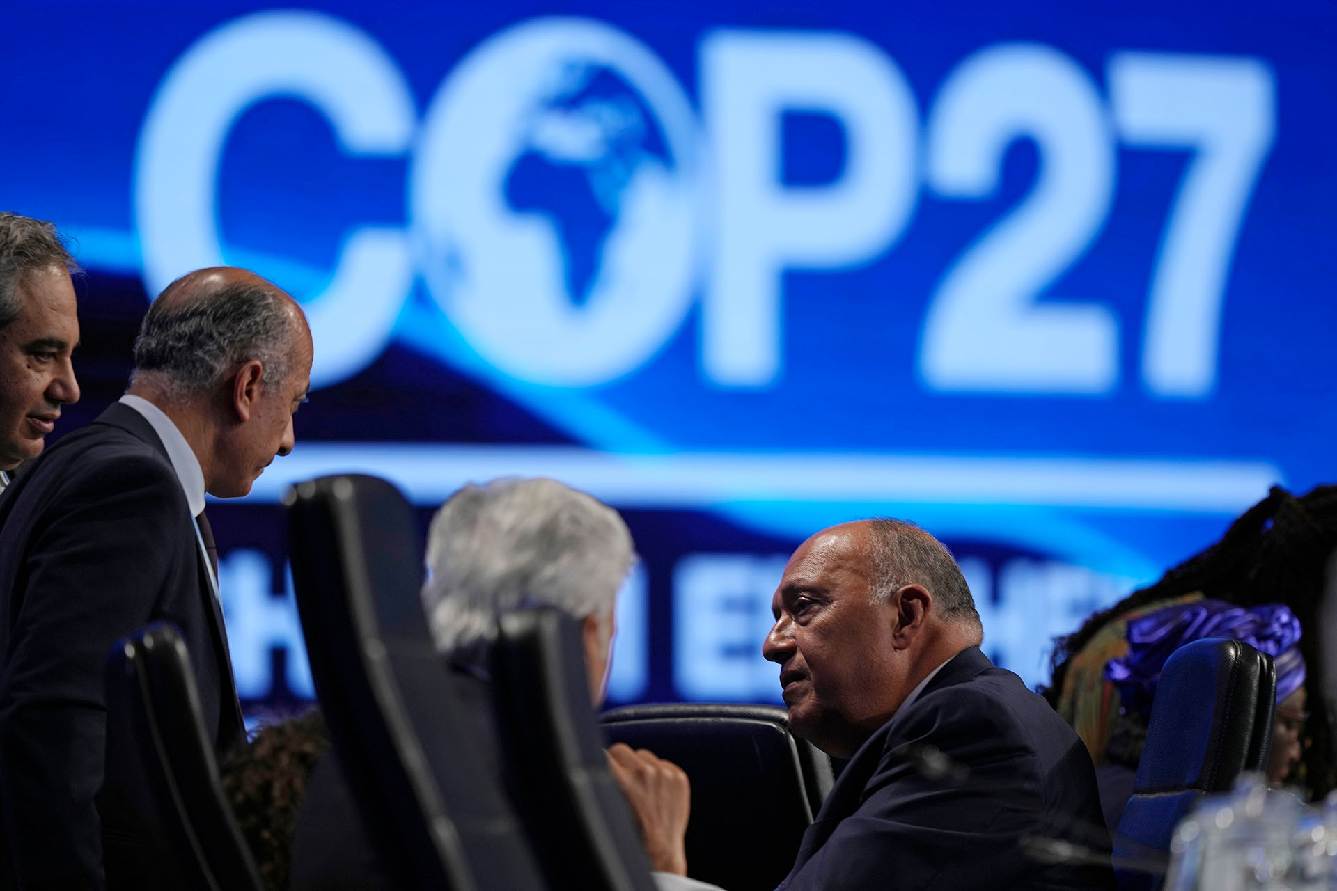 Sameh Shoukry, president of the COP27 climate summit, right, talks with others at a closing plenary session at the U.N. Climate Summit, Sunday, Nov. 20, 2022, in Sharm el-Sheikh, Egypt.